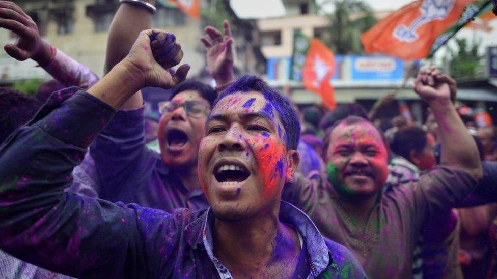 Ruling Bharatiya Janata Party (BJP) supporters celebrates after winning majority of the seats in Assam Assembly election in Guwahati city, Assam, India, 19 May 2016