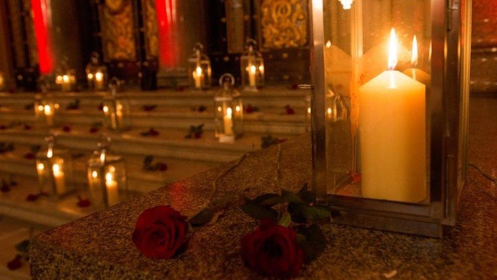 Candles are lit and roses laid to commemorate the victims of the Hillsborough disaster at St George"s Hall