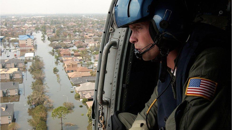 A Coast Guard pilot surveys the flooding after Hurricane Katrina hit New Orleans in 2006