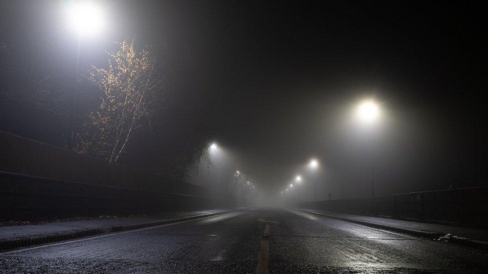 A street illuminated with street lamps