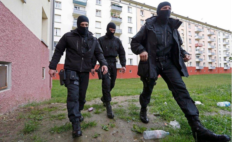 File picture shows French special Police forces as they patrol a residential building area in the Meinau suburb of Strasbourg, May 13. 2014.