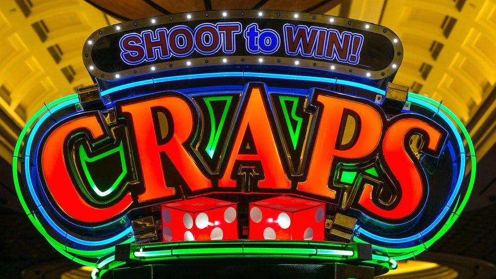 An illuminated sign for the casino game "craps" at Caesars Palace Hotel in Las Vegas, Nevada, 29 May 2017