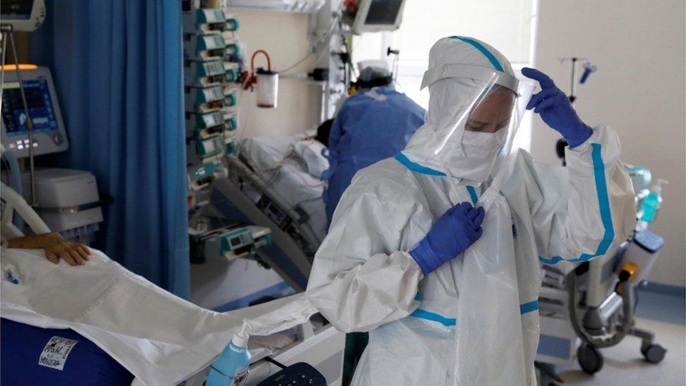 Medical staff treat a patient inside of the extracorporeal membrane oxygenation (ECMO) coronavirus disease ward at the Interior and Administration Ministry (MSWiA) hospital in Warsaw