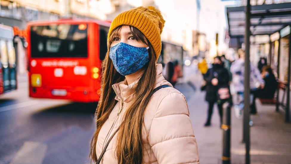 girl-wearing-mask-in-street