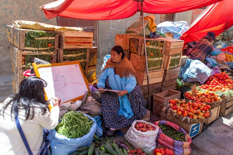 Keyla Guzman Velez teaching basic maths in the Rodriguez market