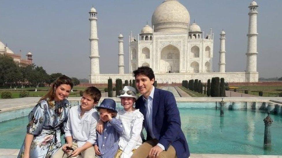 Canadian Prime Minister Justin Trudeau (R), accompanied by his wife Sophie Gregoire Trudeau (L) and their children pose for photographs at the landmark Taj Mahal in Agra, India, 18 February 2018.