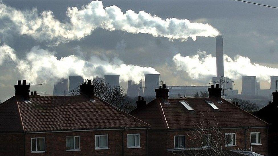 Houses with coal-fired power station in the background