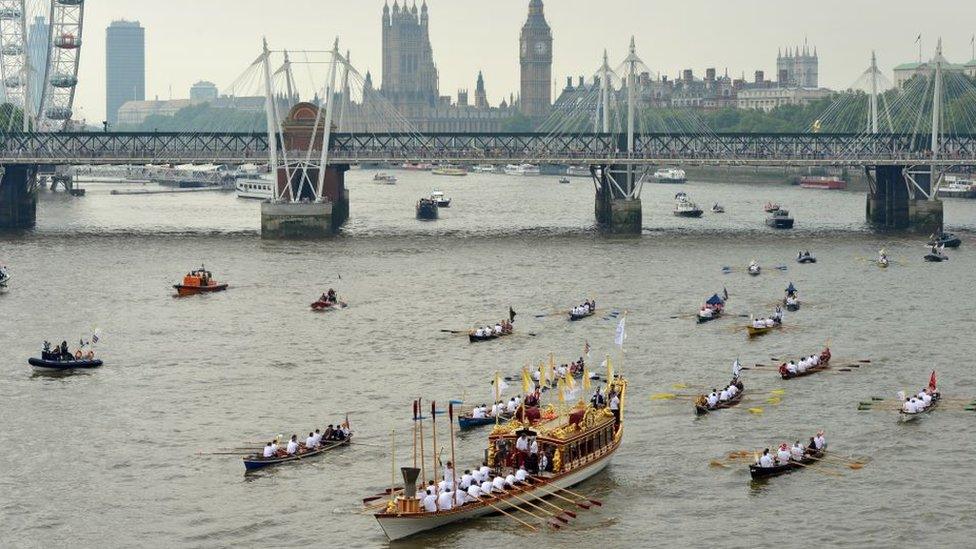 The royal barge Gloriana carrying the Olympic flame on the 70th and final day of the London 2012 Olympic Torch relay