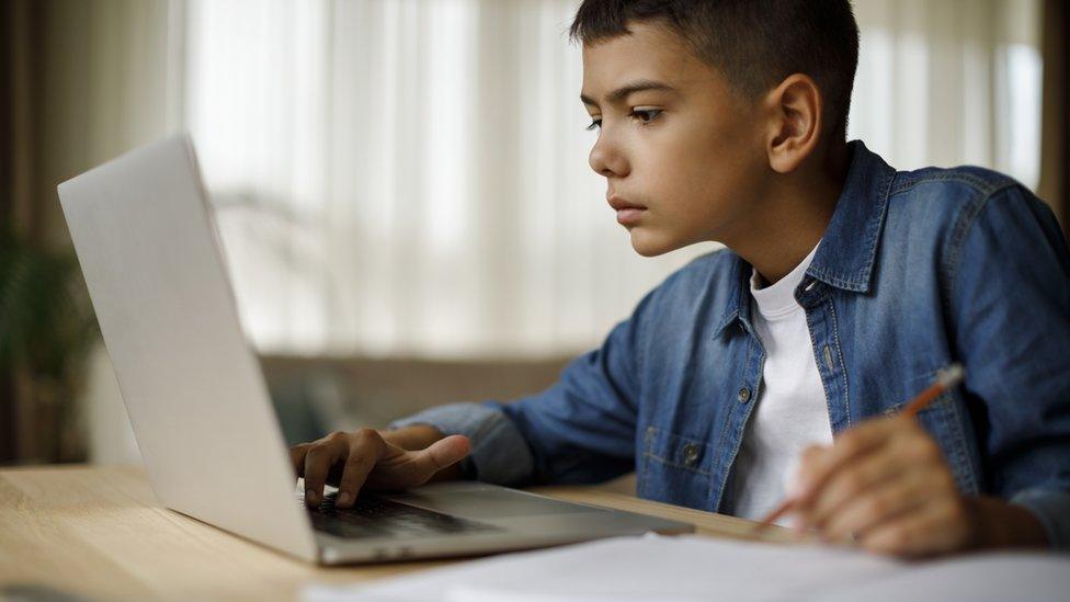 boy working at desk