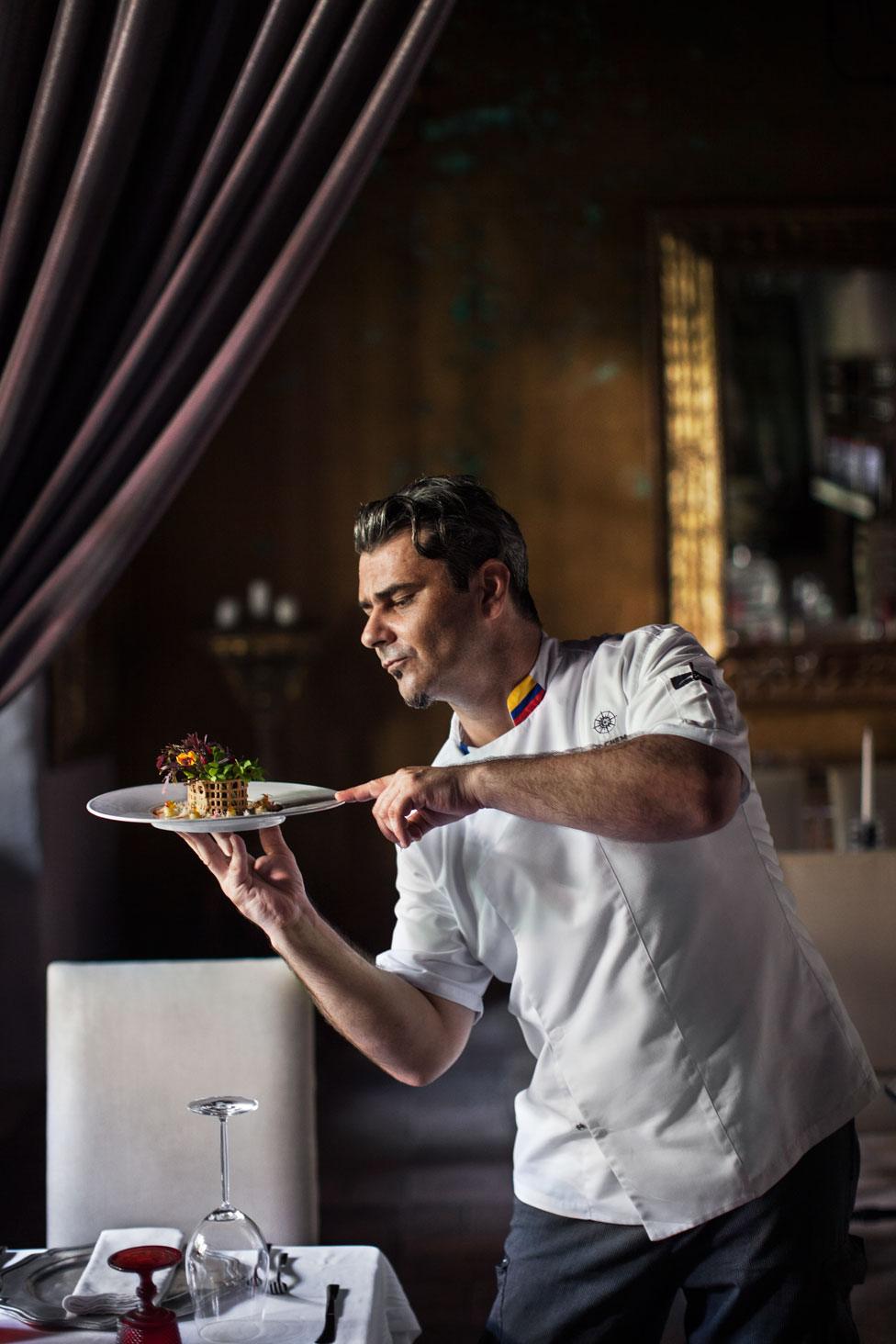 A chef at a hotel in Cartegnena in Colombia with his dish