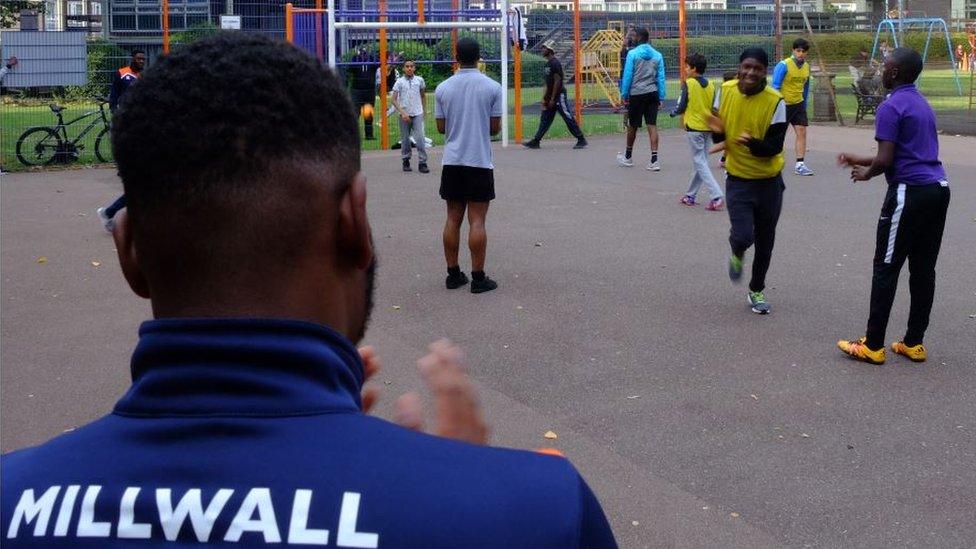 Youngsters play football on the Avondale Square Estate