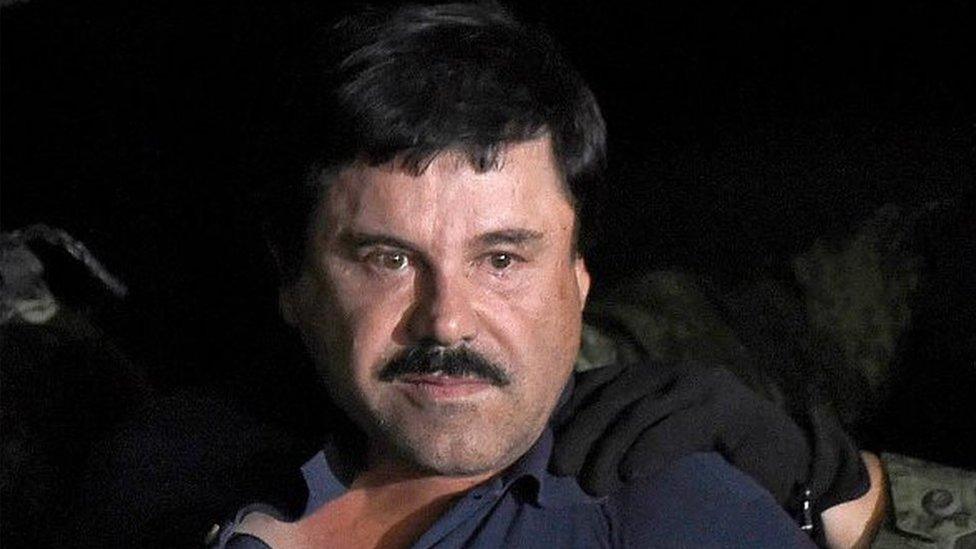 Joaquin "El Chapo" Guzman is escorted into a helicopter at Mexico City's airport on January 8, 2016 following his recapture during an intense military operation in Los Mochis, in Sinaloa State.