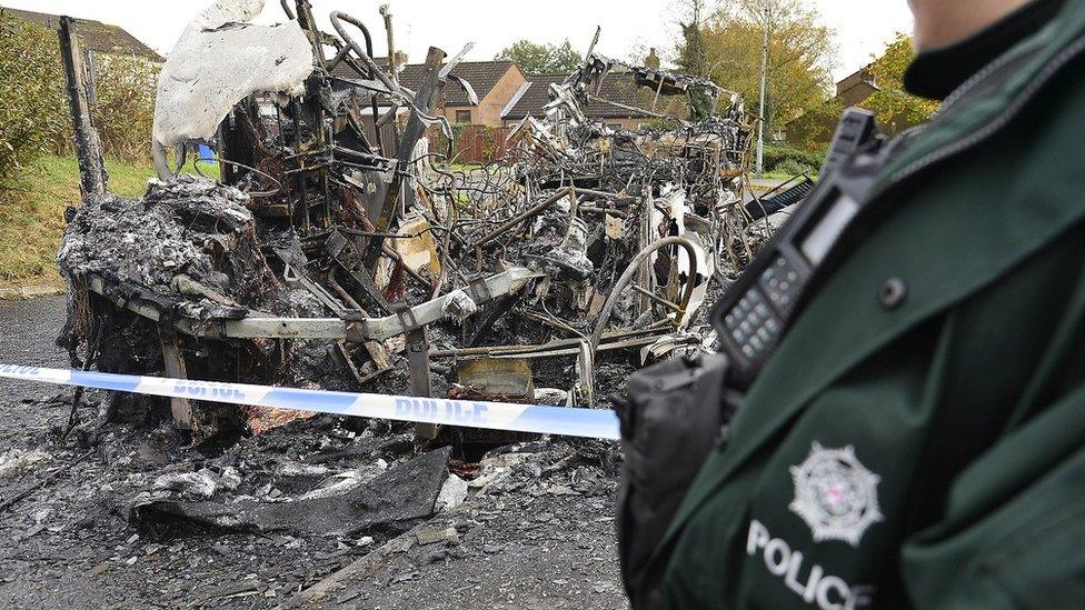 Police at scene of burnt out bus in Newtownards