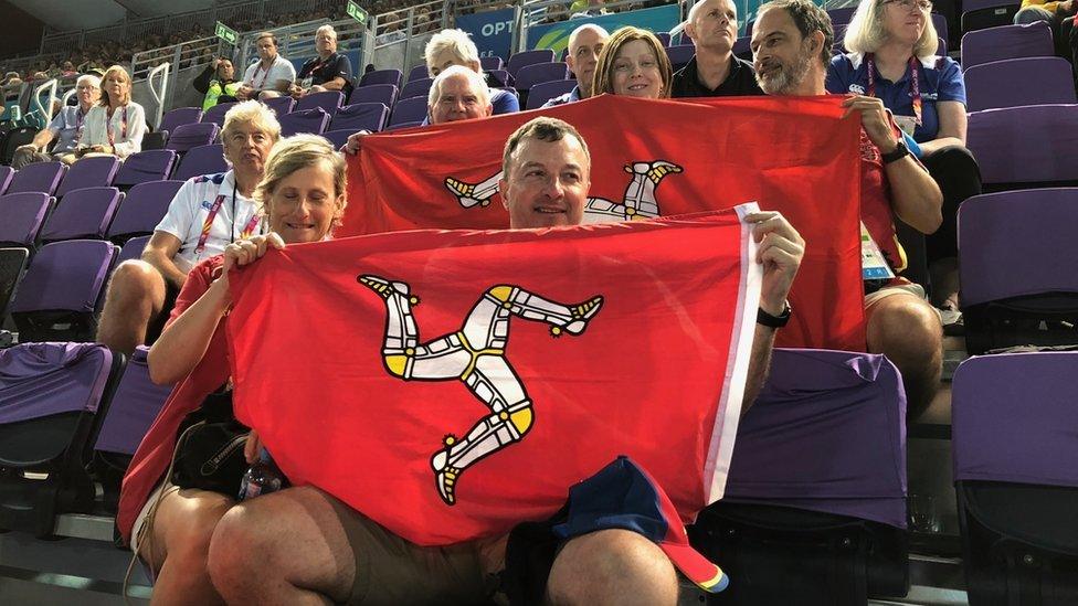 Commonwealth Games spectators waving Manx flag