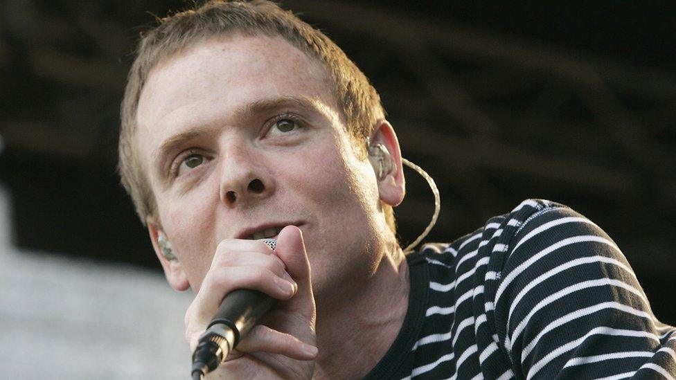 Stuart Murdoch of Belle and Sebastian performs on stage as part of the Love Music Hate Racism Rally in Trafalgar Square on April 29, 2006 in London, England.