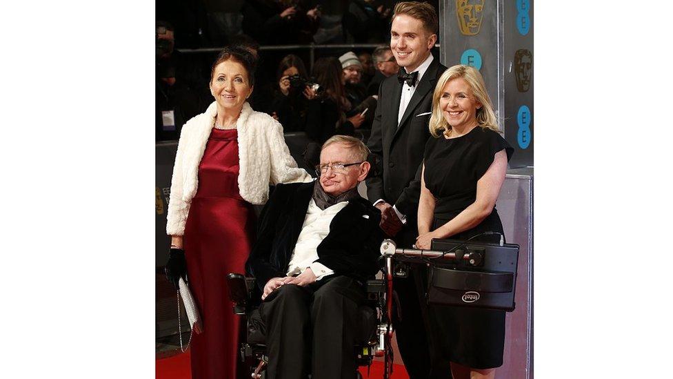 British scientist Stephen Hawking (C) arrives on the red carpet with former wife Jane Hawking (L) and daughter Lucy Hawking (R) for the BAFTA British Academy Film Awards at the Royal Opera House in London on February 8, 2015