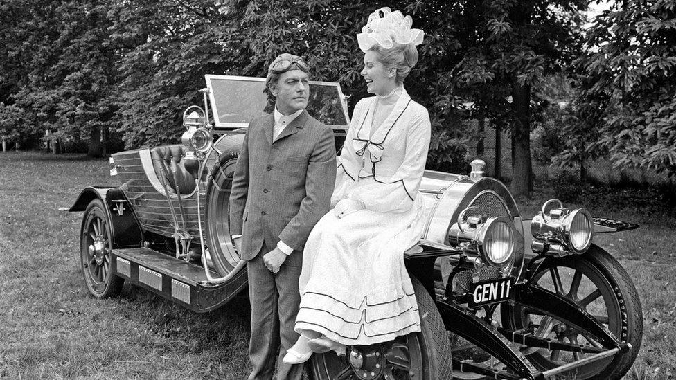 Black and white photo of Dick Van Dyke and Sally Ann Howes with Chitty Chitty Bang Bang