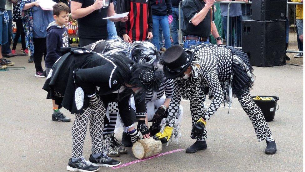 A team at the start line of the 2017 chees rolling event