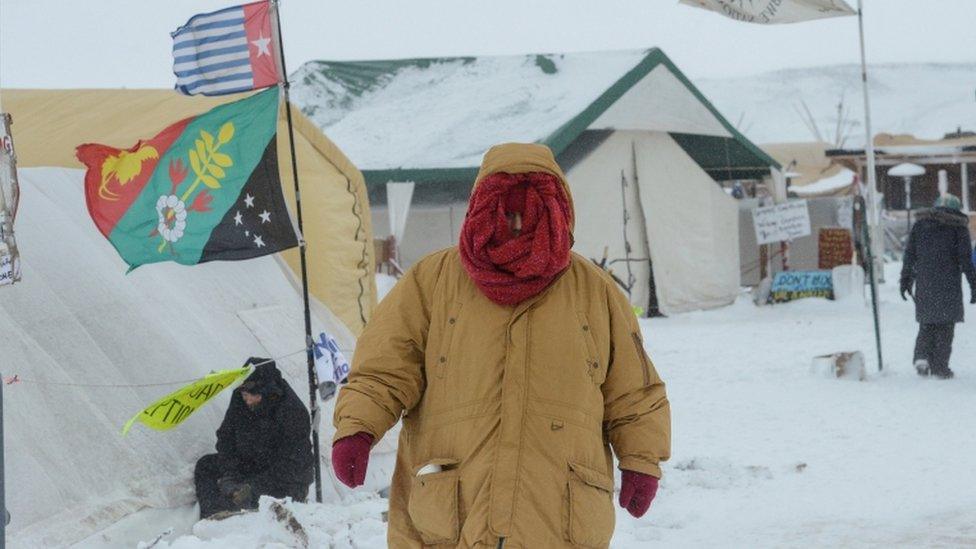 protester in snow storm