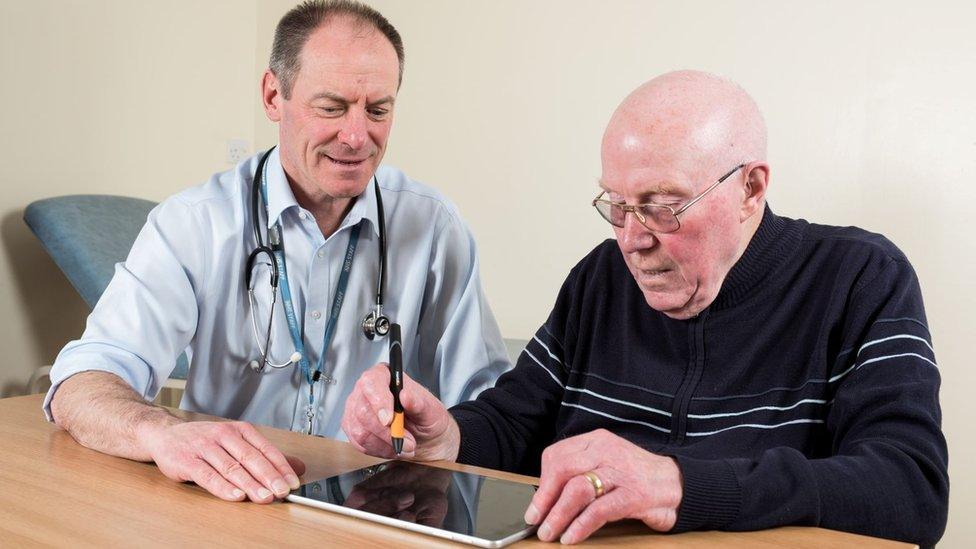 Patient using a NeuroMotor Pen