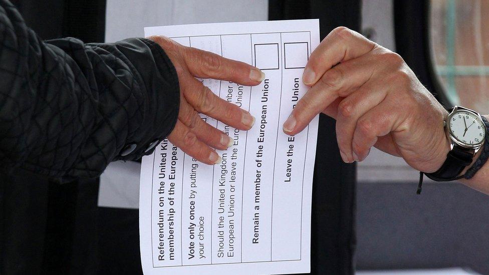 Ballot paper changing hands