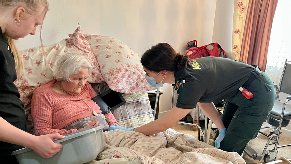 Paramedics treat Eva Denny