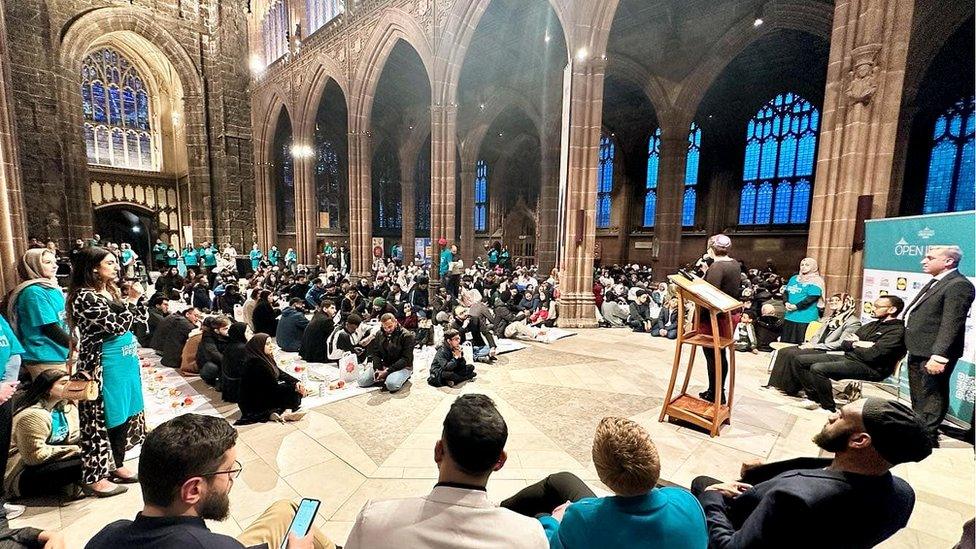 people watch rabbi speak at the Manchester cathedral event