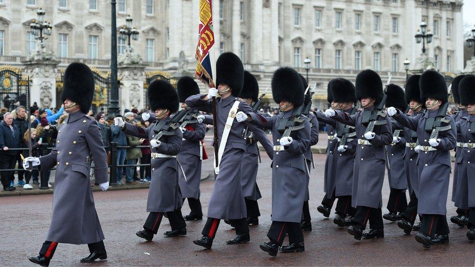 Soldiers from the Coldstream Guards during the Changing of the Guard at Buckingham Palace in London,