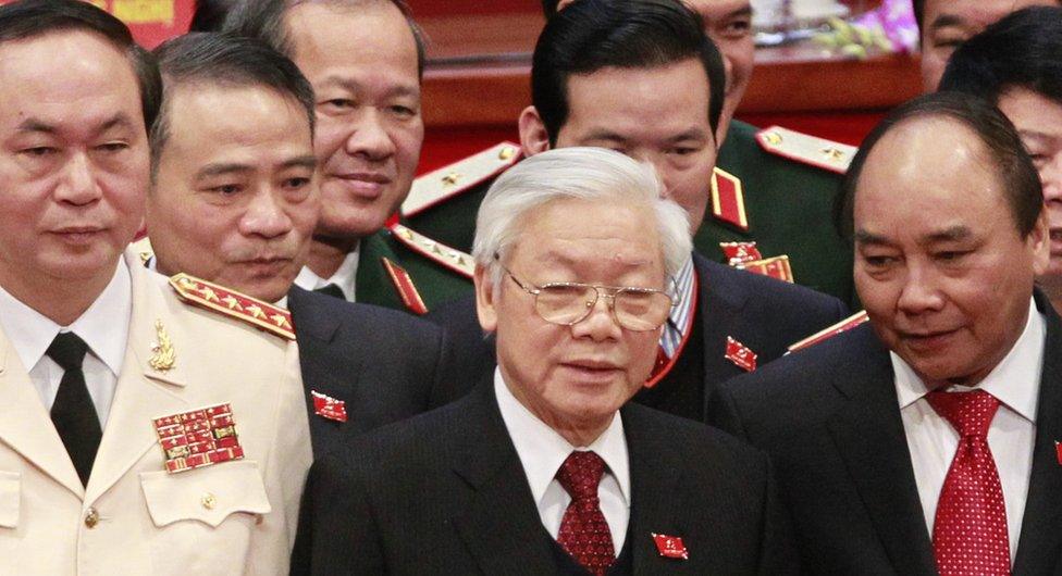 General Secretary Nguyen Phu Trong, center, poses with Deputy Prime Minister Nguyen Xuan Phuc, right, and Public Security Minister Tran Dai Quang, left, for a photo during the closing ceremony of the 12th National Congress of Vietnam"s Communist Party in Hanoi, Vietnam, Thursday, 28 Jan 2016