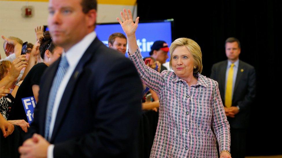 Secret Service agents surround U.S. Democratic presidential candidate Hillary Clinton