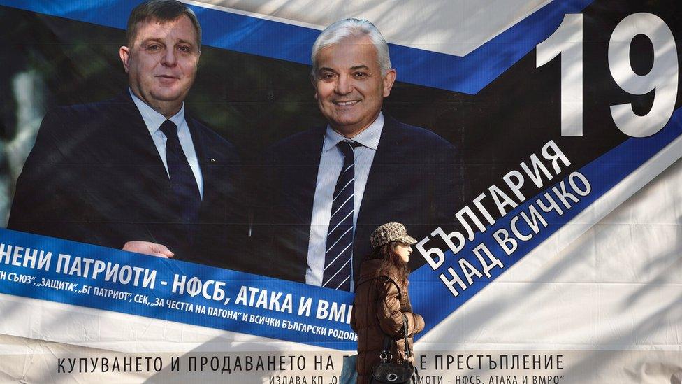 A woman passes campaign posters of Presidential and vice candidate of Bulgaria"s Coalition of Nationalist parties Krasimir Karakachanov (L) and Yavor Notev in Sofia, Bulgaria, 02 November 2016.