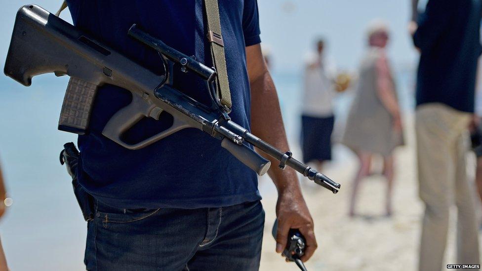 Armed policeman on Marhaba beach, Sousse, 28 June 2015