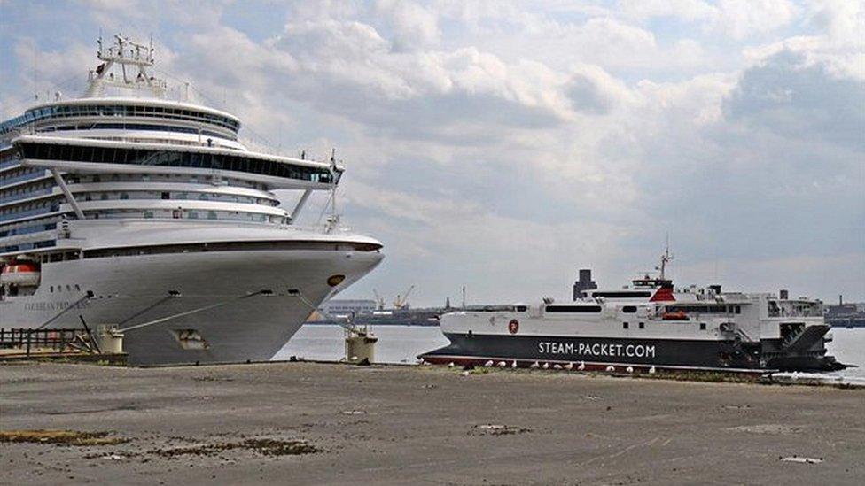 the Steam Packet catamaran passes the Caribbean Princess, and the derelict Princes Jetty