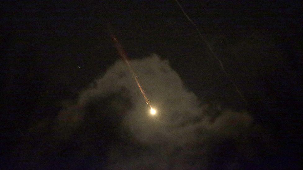 A view from the southern Gaza strip shows drones or missiles vying for targets in southern Israel, early 14 April 2024.