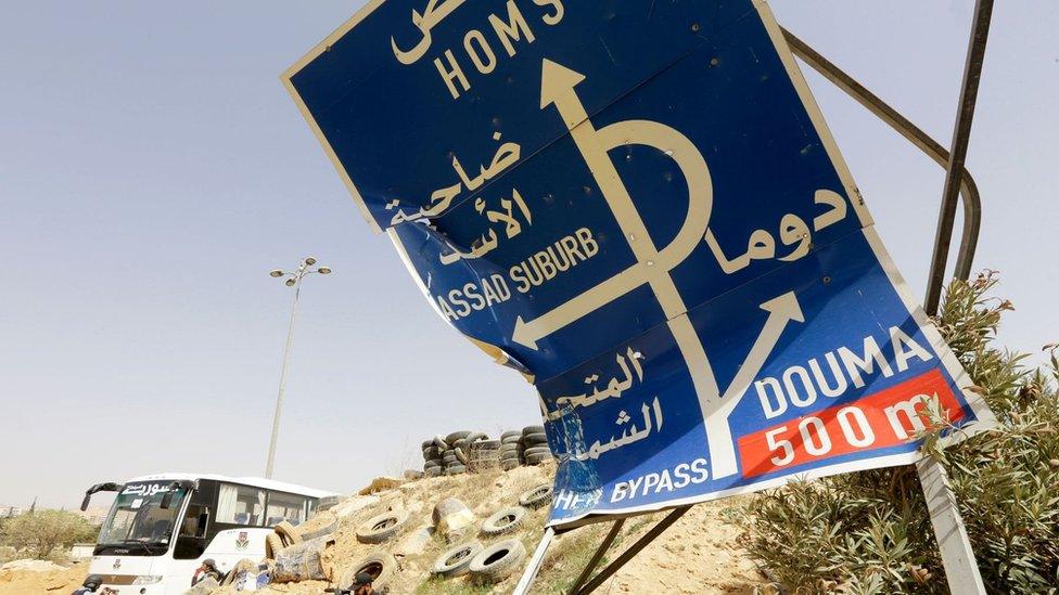 Road sign outside the entrance to Harasta, in the Eastern Ghouta region outside Damascus