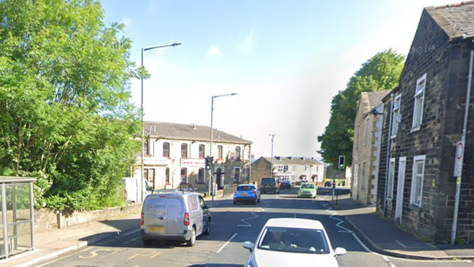 A street view of Colne Road in Brierfield