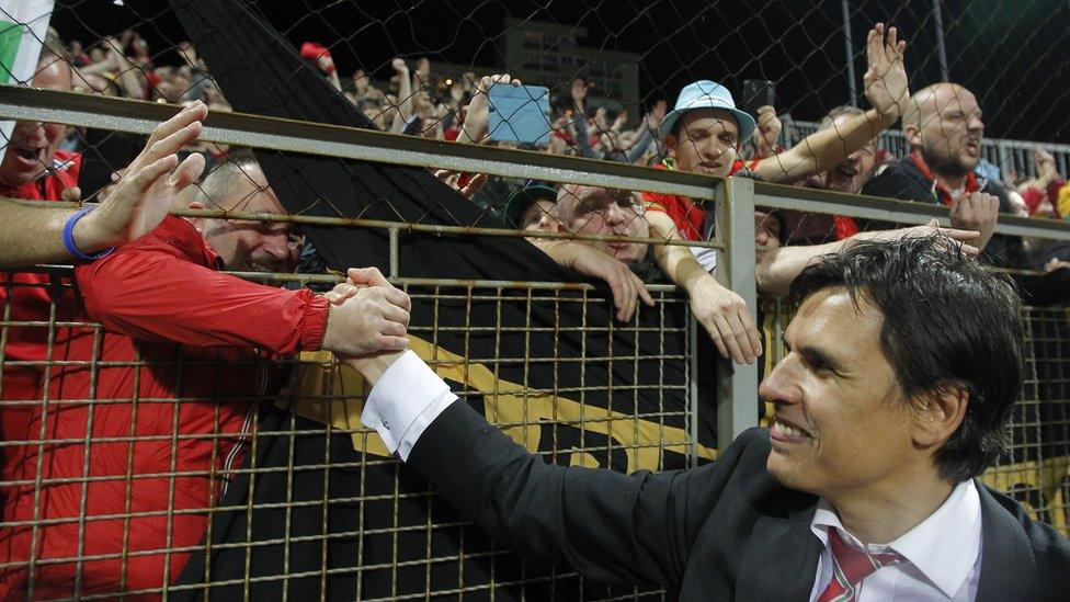 Wales' head coach Chris Coleman celebrates the result with fans.