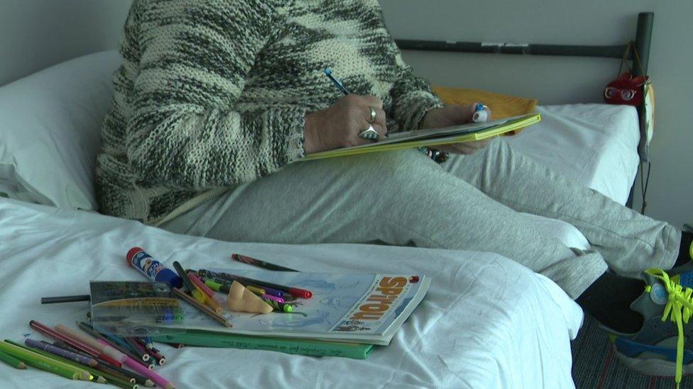 Woman on bed in converted office