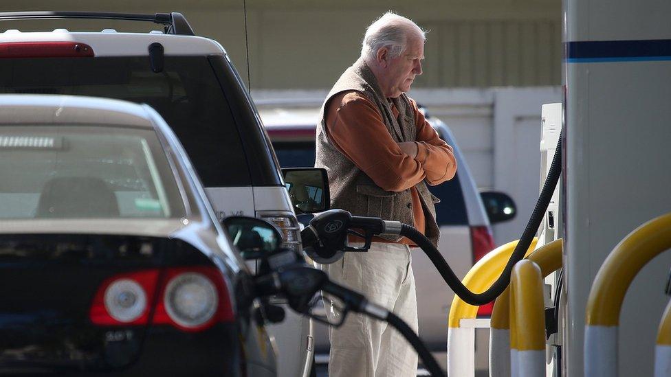 man at gas station