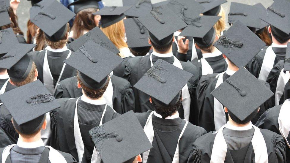 graduates in mortar boards