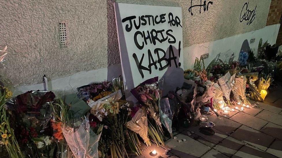 Floral tributes and candles at the vigil