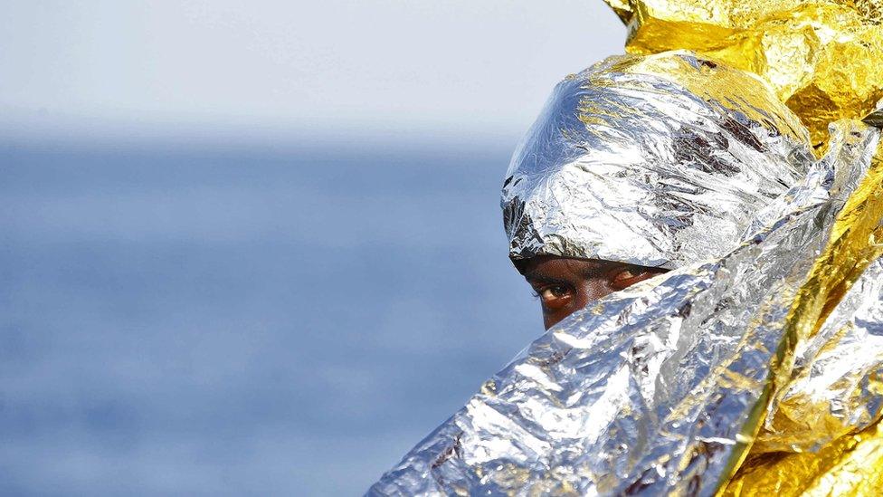 A migrant waits to disembark from the rescue vessel Responder,