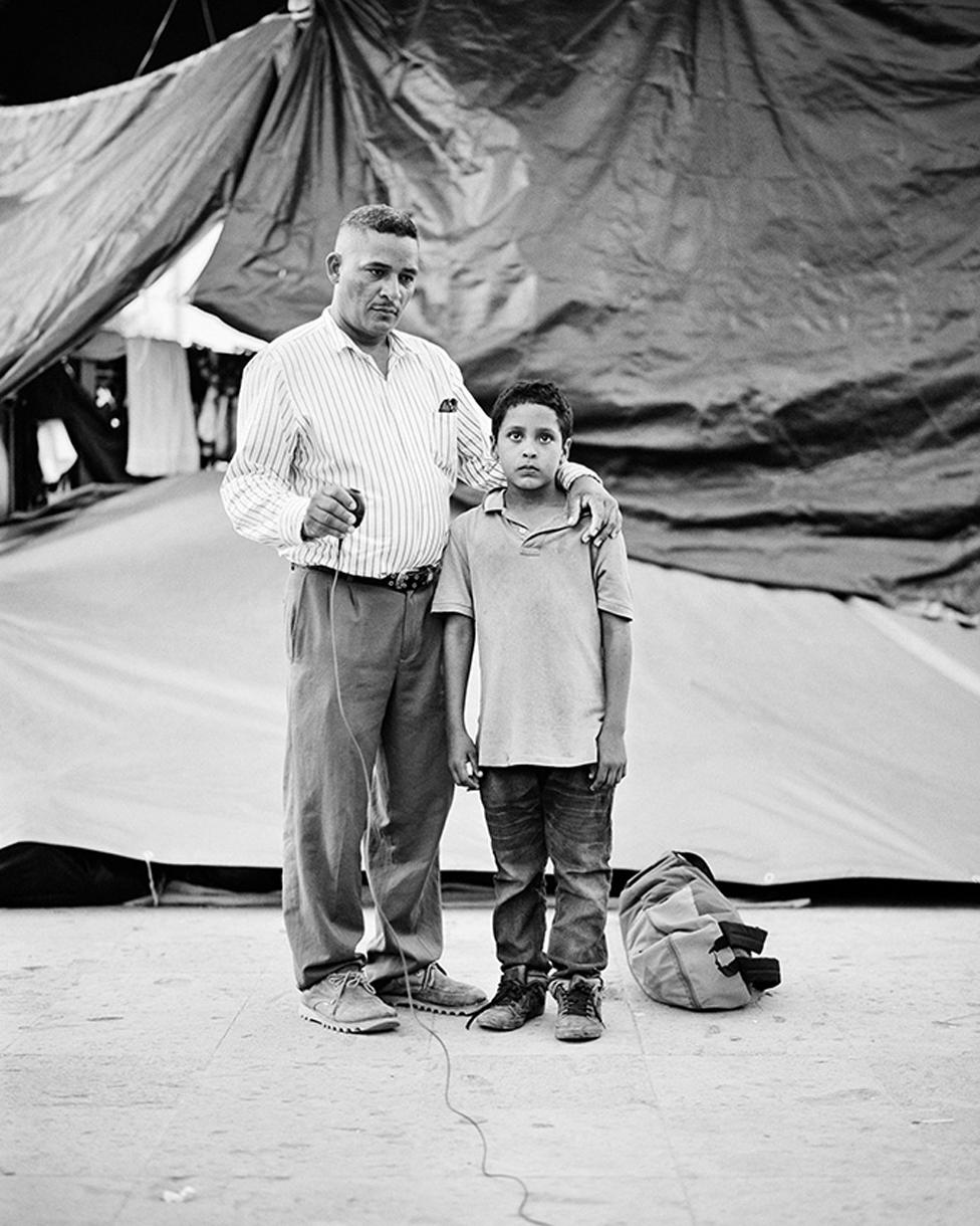 Edwardo Benavides, 40 and his son Jonathon Benavides Reyes, 9, migrants from La Union, El Salvador