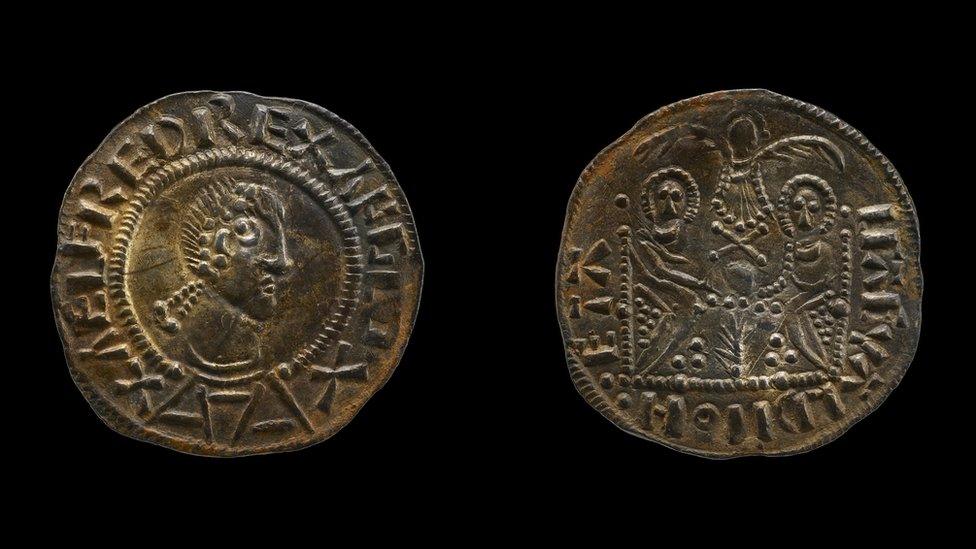 The faces of a Double Emperor coin