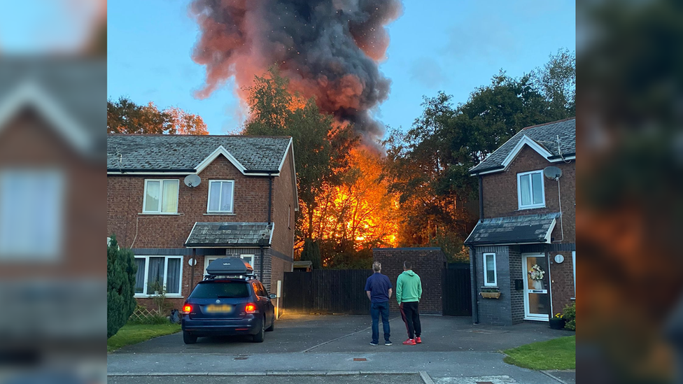 The fire behind a house