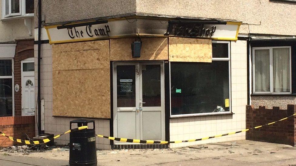 The chip shop as it appears now, with boarded up windows