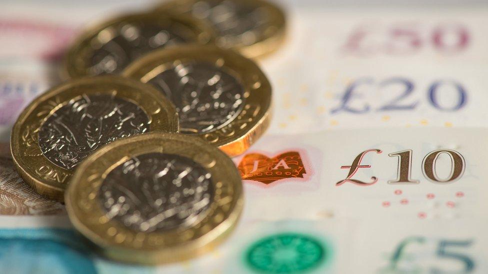 File photo dated 26/01/18 of pound coins and English bank notes