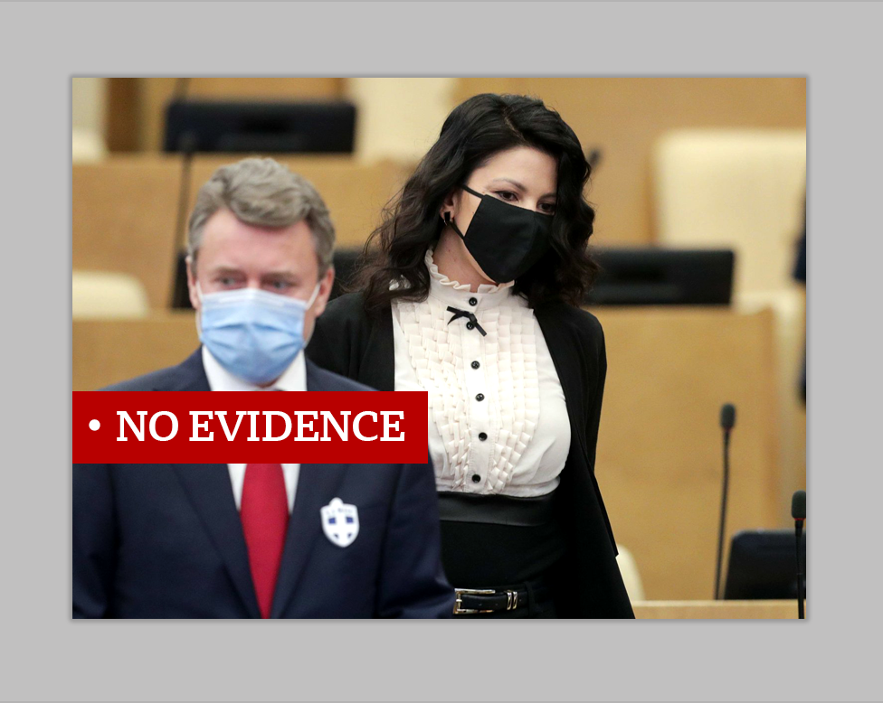 Two people with face masks, one sporting a badge with a cross on it. Labeled "no evidence".