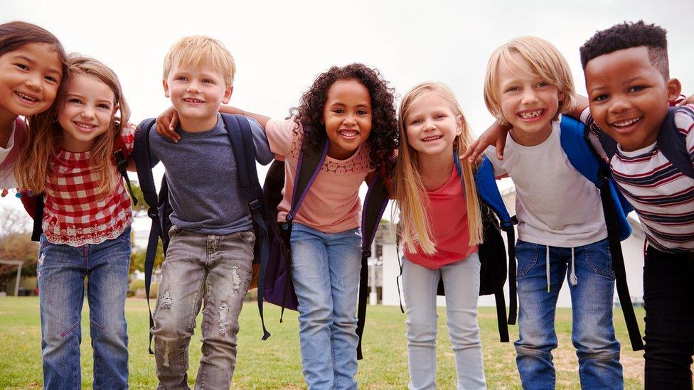 children-smiling-and-hugging
