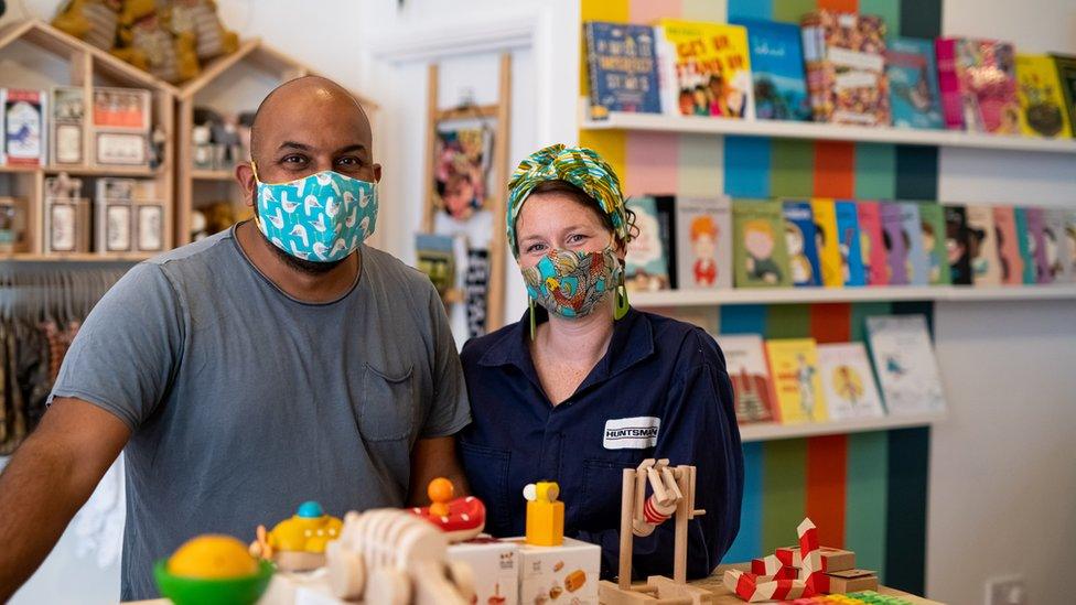 Naveed and Charlotte Khan in their store